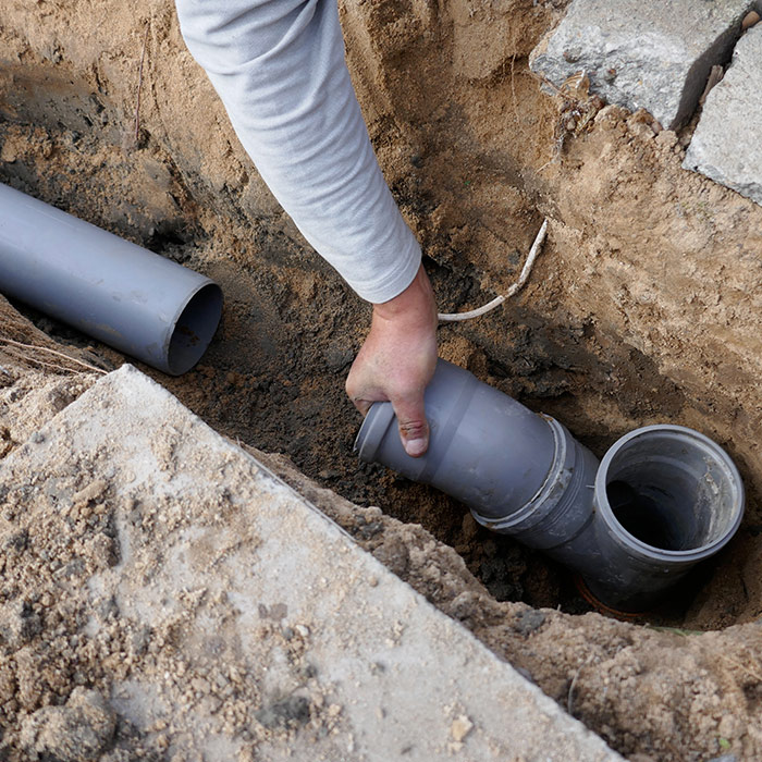 contractor-hand-close-up-sewer-pipelining-at-property-st-charles-mo